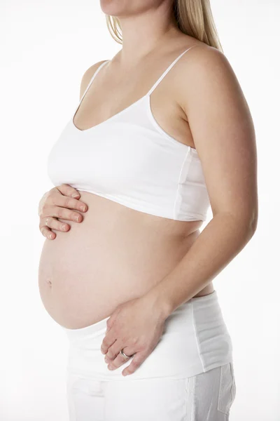 Close Up Studio Portrait Of 5 months Pregnant Woman Wearing Whit — Stock Photo, Image