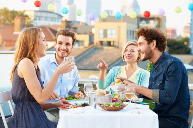 Group Of Friends Eating Meal clipart
