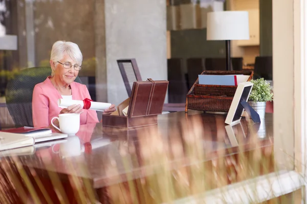 Woman Putting Will Into Box — Stock Photo, Image