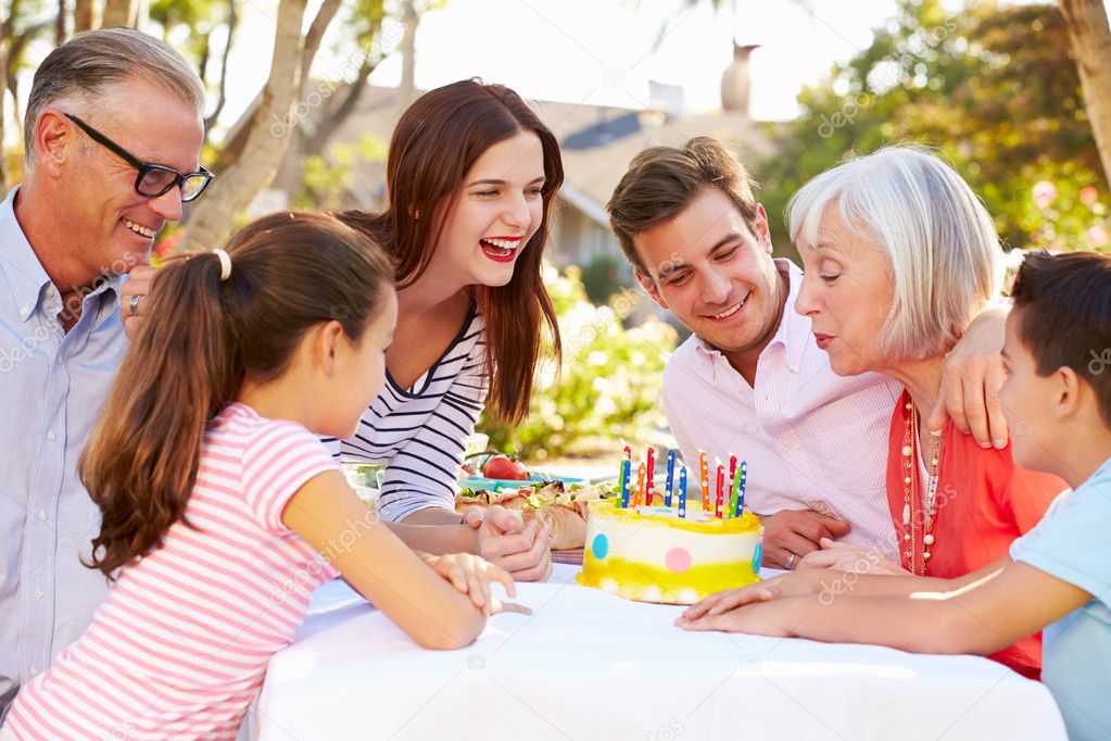 Multi Generation Family Celebrating Birthday Stock Photo Multi Generation Family Celebrating Birthday Stock Photo