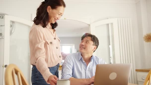 Mature Asian Woman Bringing Husband Coffee Home Check Household Bills — Stock Video