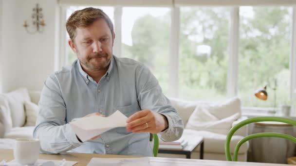 Smiling Man Sitting Table Home Reviewing Domestic Finances Opening Letter — Stock Video