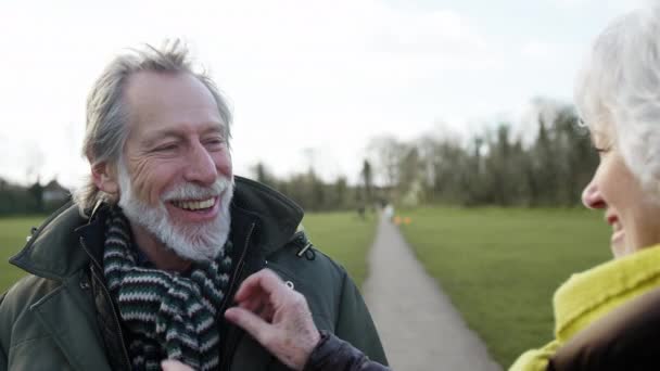 Woman Ties Mans Scarf Senior Couple Enjoying Autumn Winter Walk — Stock Video