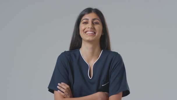 Studio Portrait Laughing Female Nurse Uniform Plain Background — Stock Video