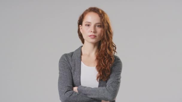 Studio Portrait Smiling Young Businesswoman Folding Arms Plain Background — Stock Video
