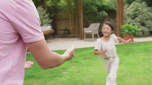 Excited Asian Daughter Running Garden Home Being Lifted Father — Stockvideo