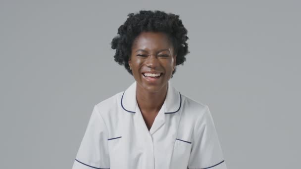 Studio Portrait Laughing Female Nurse Uniform Plain Background — Stock Video