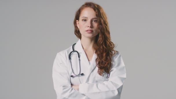 Studio Portrait Serious Female Doctor Stethoscope White Coat Plain Background — Stock Video