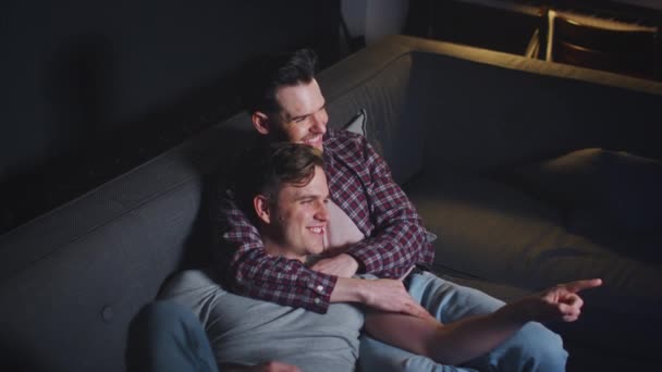 Loving Same Sex Male Couple Lying Sofa Home Hugging Laughing — Stock Video