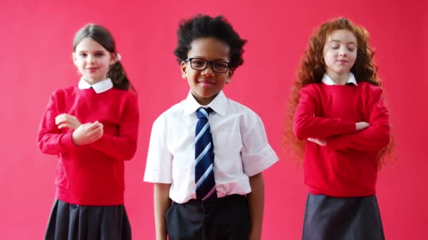 Group Elementary School Pupils Wearing Uniform Folding Arms Red Studio — Stock Video