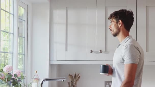 Morning Shot Man Standing Kitchen Window Relaxing Hot Drink Shot — Stock Video