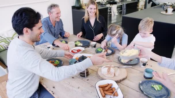 Multi Generation Family Sitting Table Home Pyjamas Enjoying Brunch Together — Stock Video