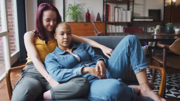 Loving Same Sex Female Couple Hugging Lie Sofa Home Watching — Stock Video