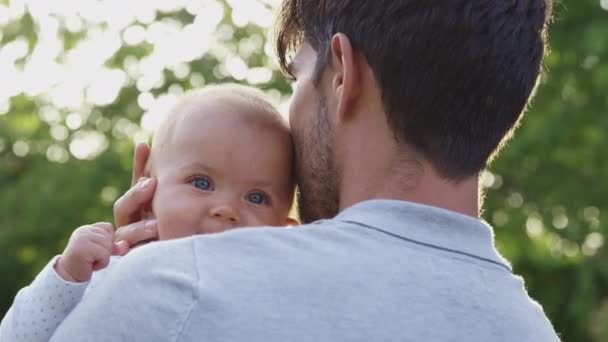 Shoulder View Loving Father Cuddling Kissing Baby Daughter Holds Her — Stock Video