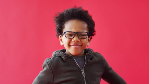 Young Casually Dressed Boy Wearing Glasses Dancing Red Studio Background — Stock Video