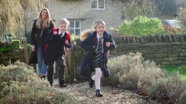 Mother Returning Home Collecting Children Wearing Uniform School Running Path — Stock Video