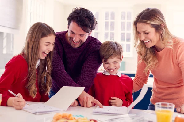 Parents Helping Children School Uniform Doing Homework Kitchen Counter — Stock Photo, Image