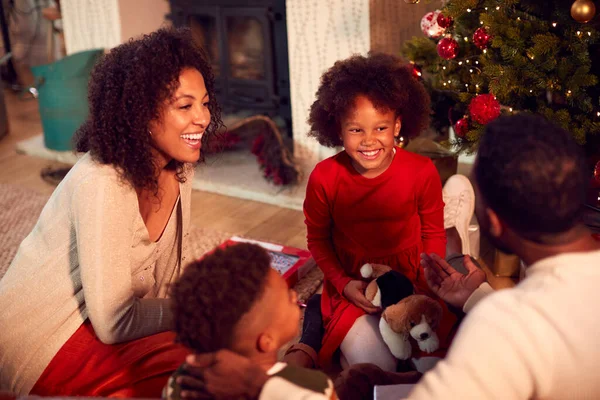 Family Exchanging Opening Gifts Christmas Tree Home — Stock Photo, Image