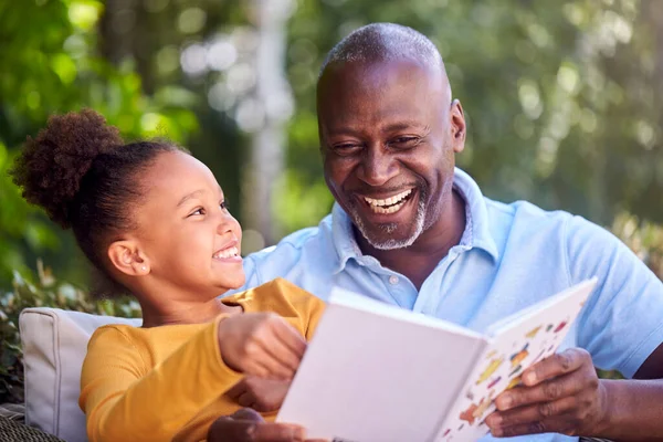 Grandfather Sitting Outdoors Granddaughter Home Reading Book Together — Stock Photo, Image