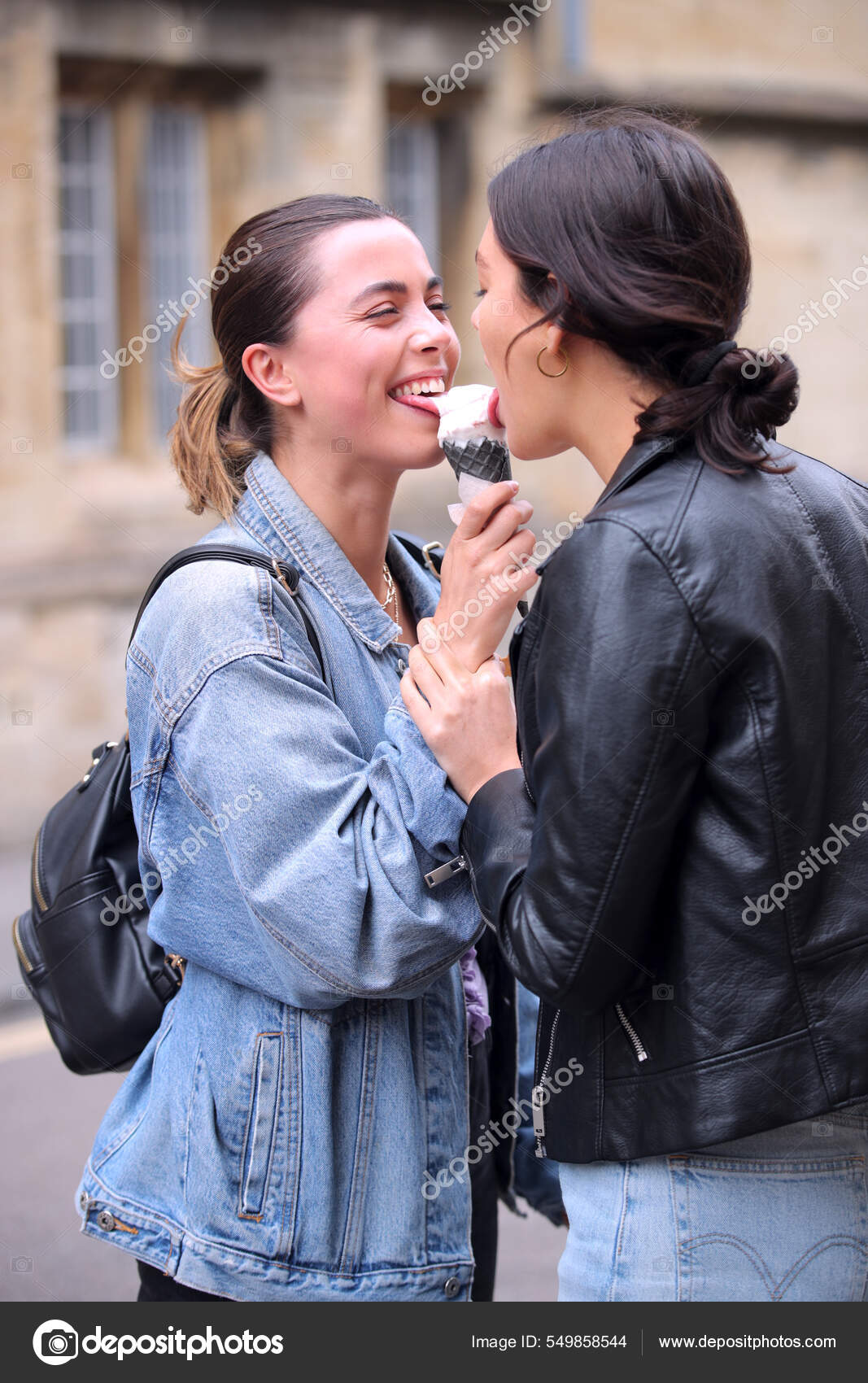 Same Sex Female Couple Sightseeing Sharing Ice Cream Walk Oxford Stock Photo by ©monkeybusiness 549858544 image