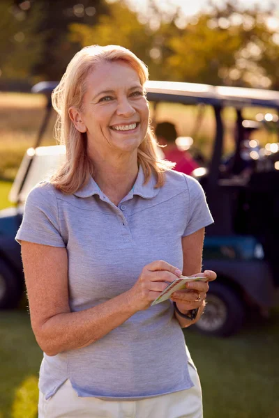 Portrait Smiling Mature Female Golfer Standing Buggy Golf Course Score — Stock Photo, Image