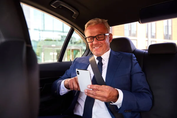 Mature Businessman Back Taxi Car Checking Messages Mobile Phone — Stock Photo, Image