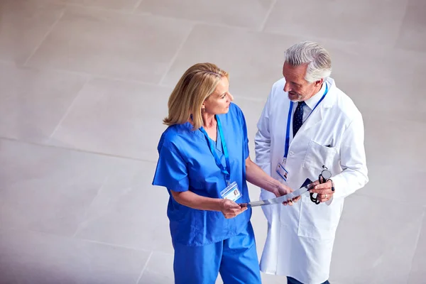 Overhead Shot Male Doctor Wearing White Coat Discussing Scan Female —  Fotos de Stock
