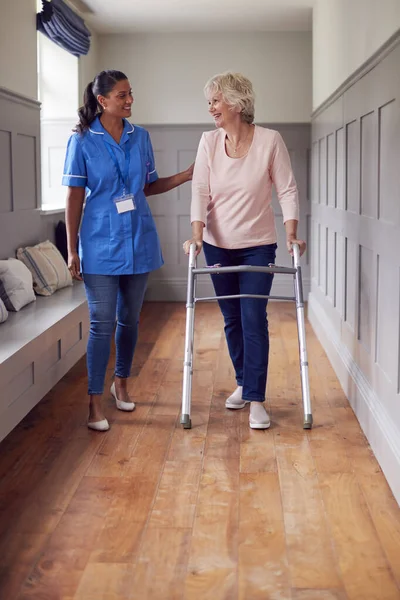 Senior Woman Home Using Walking Frame Being Helped Female Care — Stock fotografie