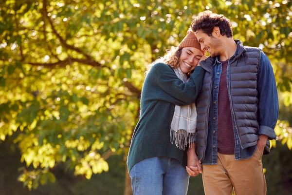 Happy Loving Couple Holding Hands Walking Autumn Park Together — Fotografia de Stock