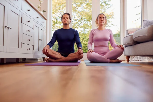 Couple Sitting Mats Home Doing Yoga Exercises Together — 스톡 사진