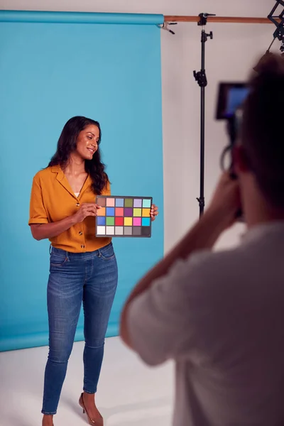 Mature Female Model Posing Background Studio Shoot Holding Colour Checker — Stok fotoğraf
