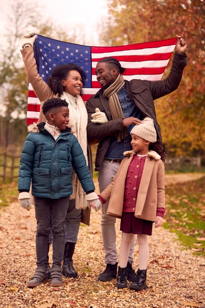 Portrait Proud American Family Holding Stars Stripes Flag Outdoors Autumn — Stockfoto