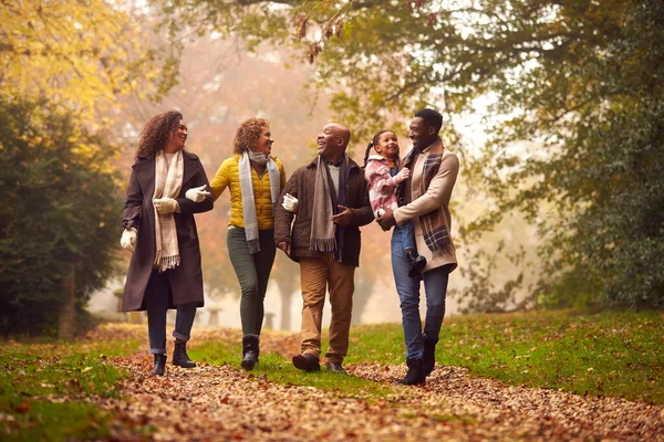 Smiling Multi Generation Family Having Fun Daughter Walking Autumn Countryside — стоковое фото