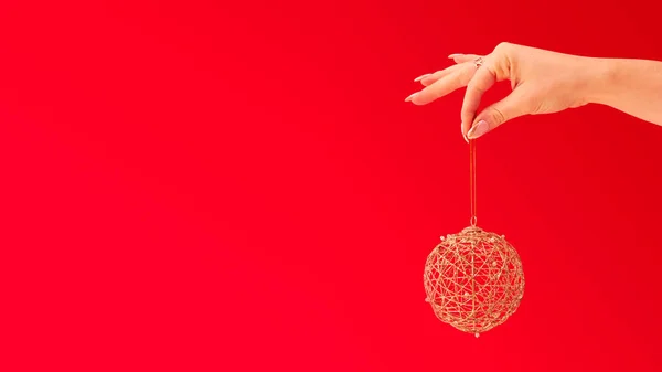 Close Studio Shot Woman Holding Christmas Tree Decoration Red Background — стокове фото