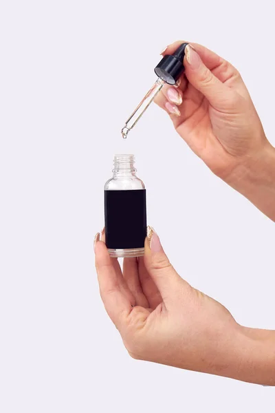 Close Studio Shot Woman Holding Bottle Essential Cannabis Oil Dropper — Foto Stock