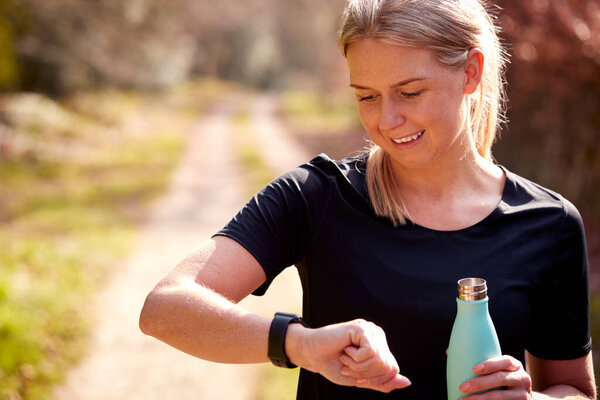 Woman Water Bottle Checking Fitness App Smart Watch Run Improve Stock Photo
