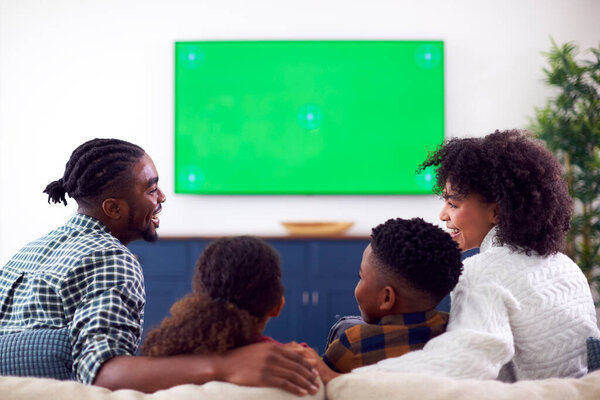 Rear View Family Sitting Sofa Watching Movie Green Screen Home Stock Image