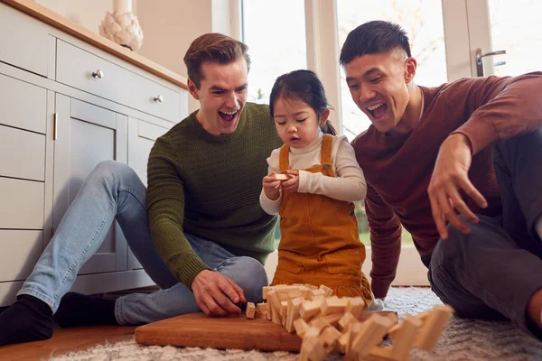 Family Two Dads Playing Game Daughter Home Stacking Wooden Bricks — Stok fotoğraf