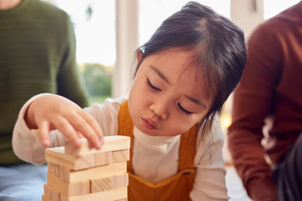 Close Family Two Dads Playing Game Daughter Stacking Wooden Bricks — 스톡 사진