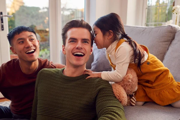 Family Two Dads Playing Game Daughter Home Whispering Secret Parent — Foto de Stock