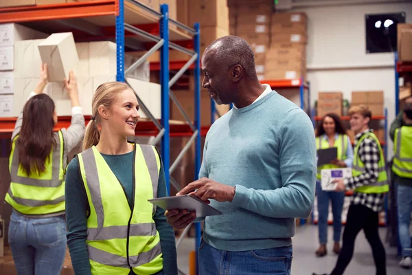 Female Intern Team Leader Looking Digital Tablet Busy Warehouse Facility — Fotografia de Stock