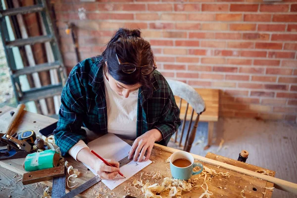 Young Female Carpenter Drawing Measuring Woodwork Design Garage Workshop —  Fotos de Stock