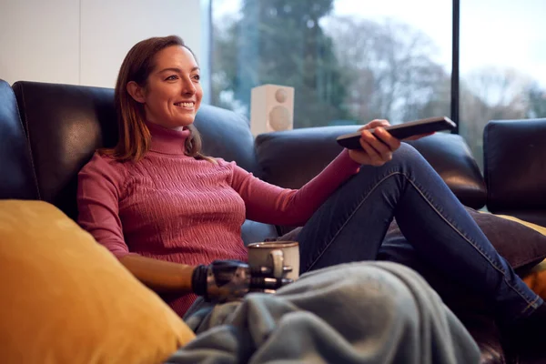 Woman Prosthetic Arm Hand Home Watching Drinking Cup Coffee —  Fotos de Stock