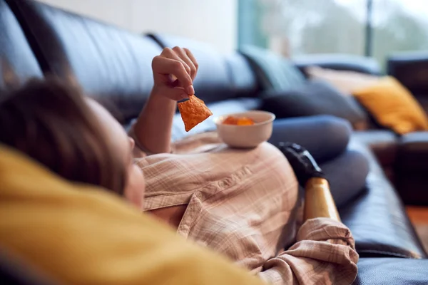 Close Pregnant Woman Prosthetic Arm Lying Sofa Home Eating Bowl — Photo