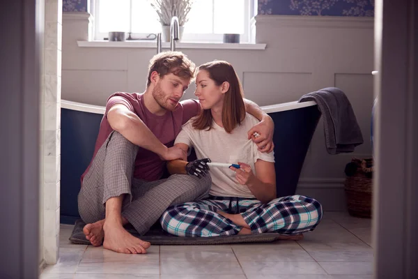 Disappointed Couple Woman Prosthetic Arm Sitting Bathroom Negative Pregnancy Test — Stockfoto