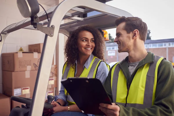 Male Female Staff Operating Fork Lift Truck Modern Warehouse — ストック写真