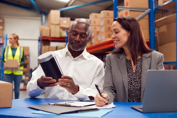 Male Female Team Leaders Laptop Warehouse Looking Product Packaging — стоковое фото