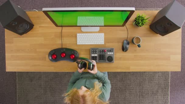 Overhead View Female Video Editor Putting Wireless Headphones Working Computer — 비디오