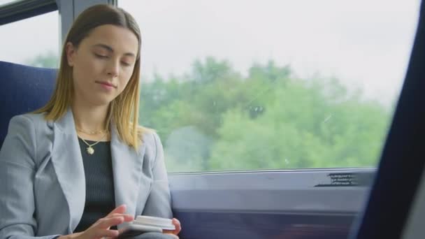 Businesswoman Takeaway Coffee Commuting Work Train Looking Mobile Phone Shot — Stockvideo