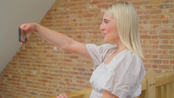 Young Woman Stands Wooden Staircase Poses Selfie Mobile Phone — Αρχείο Βίντεο